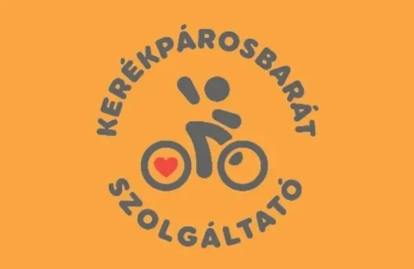 Kerékpárosbarát szolgáltató embléma narancssárga háttéren